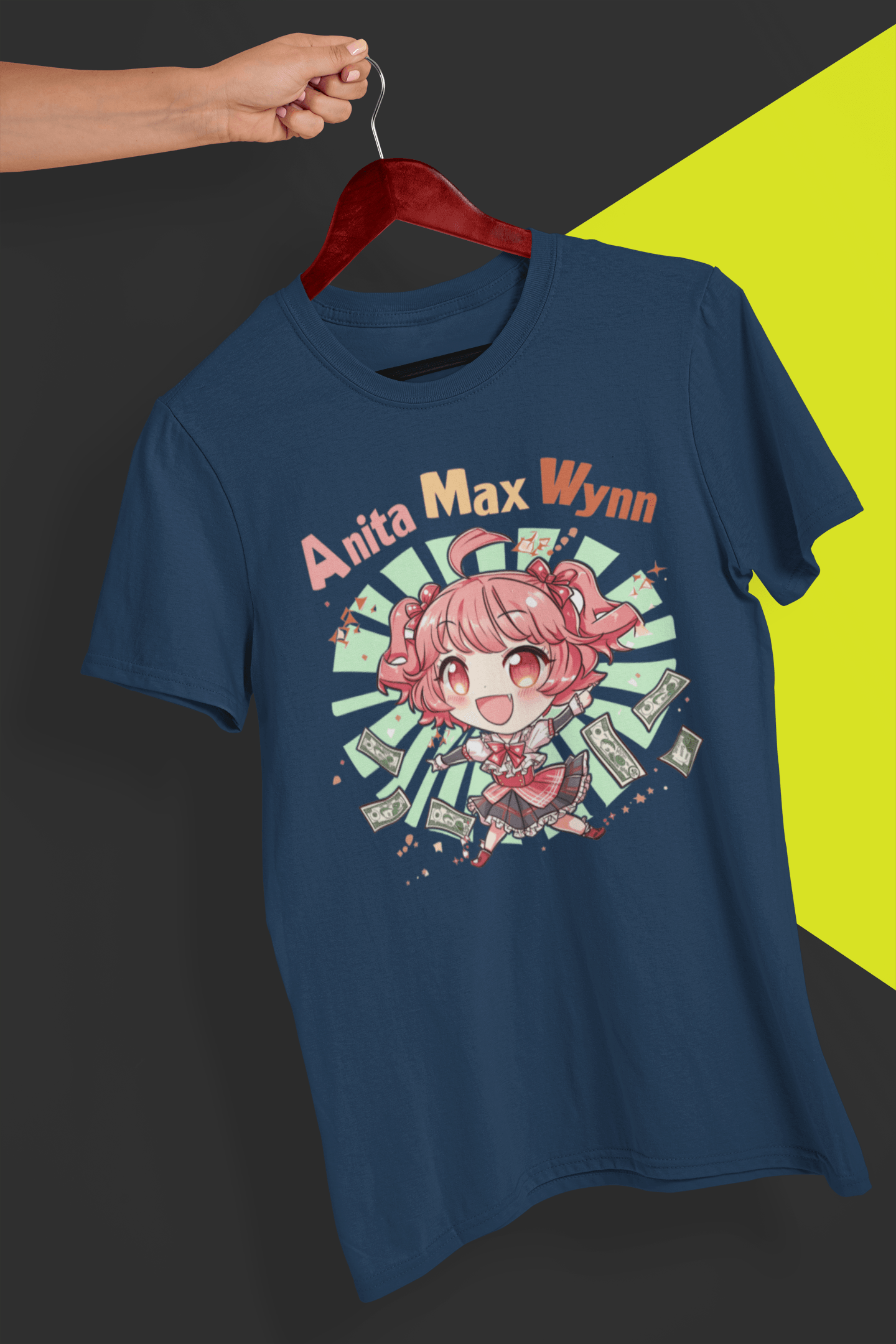 A navy-blue T-shirt with a cute chibi anime girl that says &quot;Anita Max Wynn&quot;, held by a hand against a split black and yellow background.