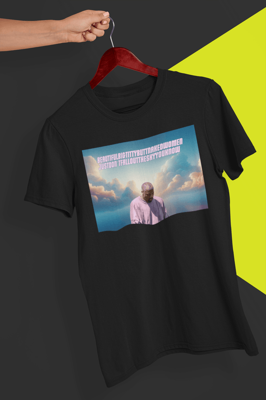 A black T-shirt withan aesthetic offensive depiction of Kanye West written &quot;Beautiful Bit Titty Butt Naked Women Just Don&#39;t Fall Out The Sky You Know&quot;, held by a hand against a split black and yellow background.