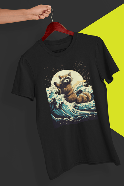 A black T-shirt with an aesthetic racoon in the waves, is hung on a red hanger, held by a hand against a split black and yellow background.