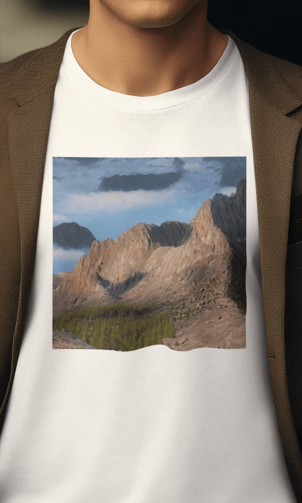 A man wears a white T-shirt featuring an AI generated landscape that looks like a cat taking a selfie staring at the camera