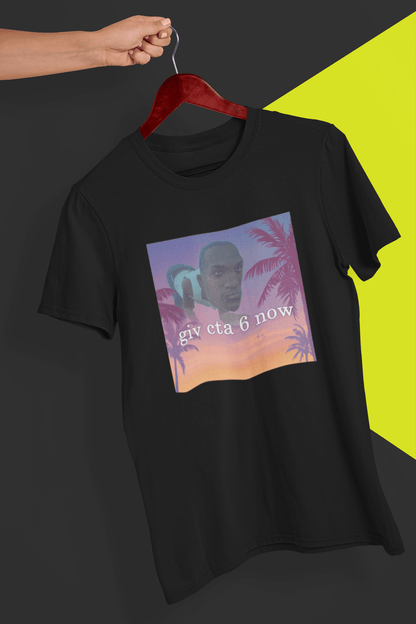 A black T-shirt with an aesthetic miami imagery and a funny depiction cj from GTA San Andreas in the background written &quot;giv cta 6 now&quot;, held by a hand against a split black and yellow background.