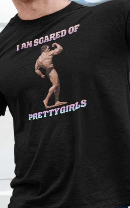 A man wears a black T-shirt featuring the bodybuilder Arnold Schwarzenegger flexing, saying &quot;I am scared of pretty girls&quot;