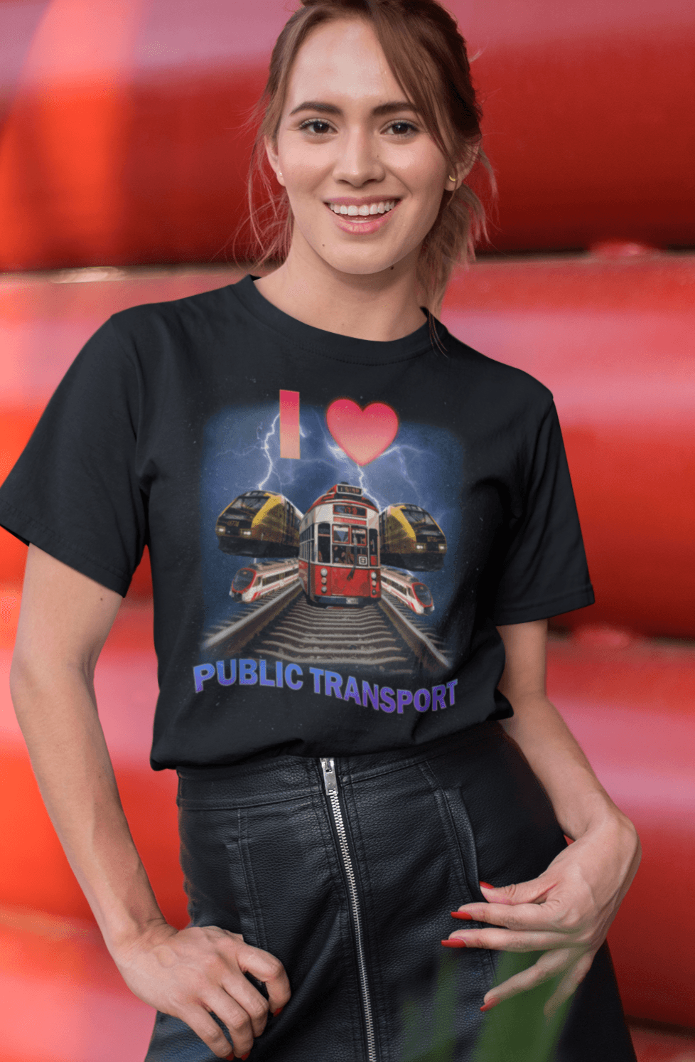 A woman wears a T-shirt with trains, trams and rails written &quot;I Love Public Transport&quot;