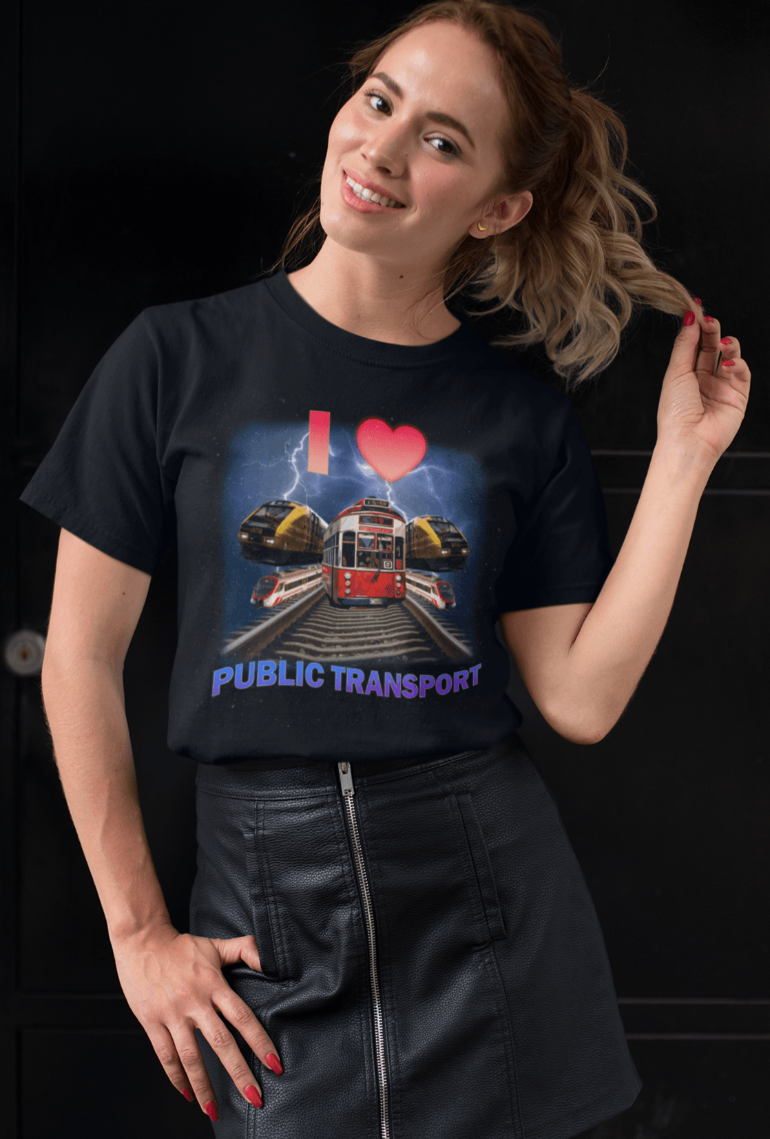 A woman wears a T-shirt with trains, trams and rails written &quot;I Love Public Transport&quot;