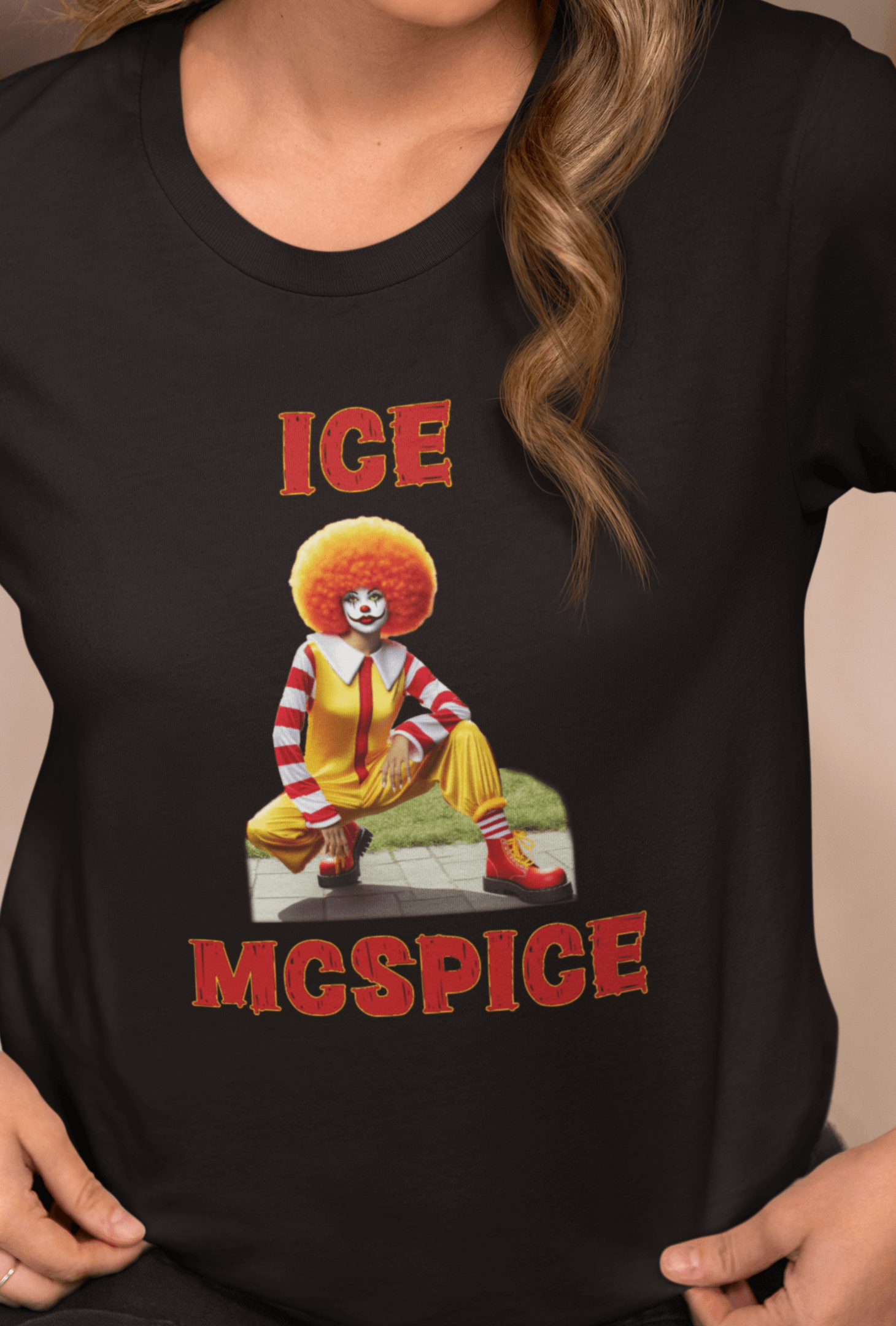 A woman wearing a black T-shirt featuring a woman who looks like the rapper Ice Spice dressed as Ronald McDonald, saying &quot;Ice McSpice&quot;