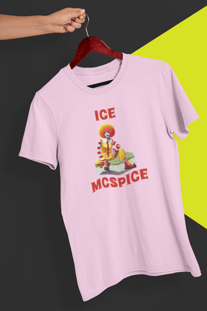 A pink T-shirt featuring a woman who looks like the rapper Ice Spice dressed as Ronald McDonald, saying &quot;Ice McSpice&quot;, held by a hand against a split black and yellow background.