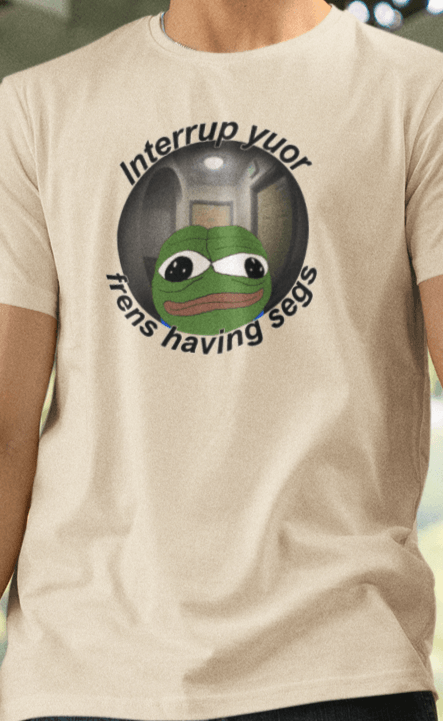 A man wears an off-white T-shirt featuring a peepo frog on the other side of a door peephole, saying &quot;Interrupt your friends having sex&quot; full of typos