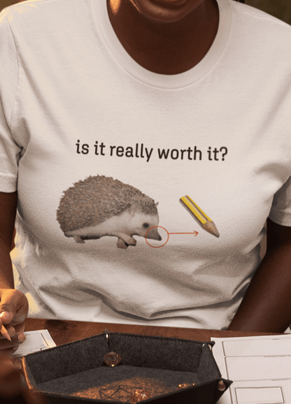 A woman wears a white T-shirt featuring a cute hedgehog, showing the similarity between its nose and the tip of a pencil, saying &quot;is it really worth it?&quot;