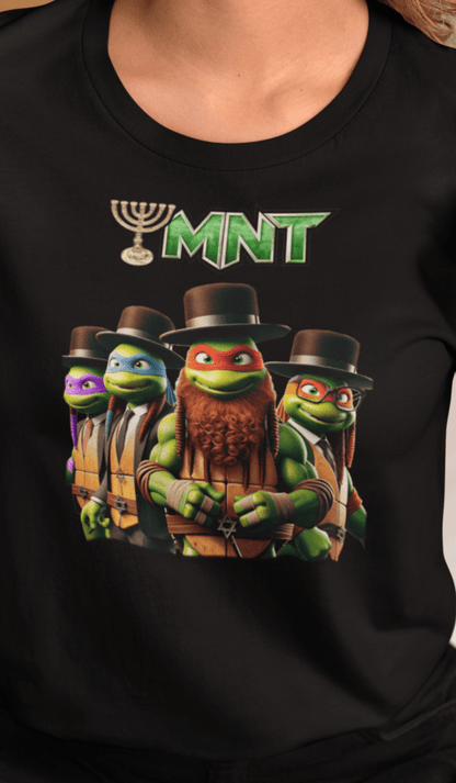 A woman wears a black T-shirt featuring Teenage Mutant Ninja Turtles wearing hasidic attire, and text that says &quot;TMNT&quot; with the &quot;T&quot; stylized as a menorah