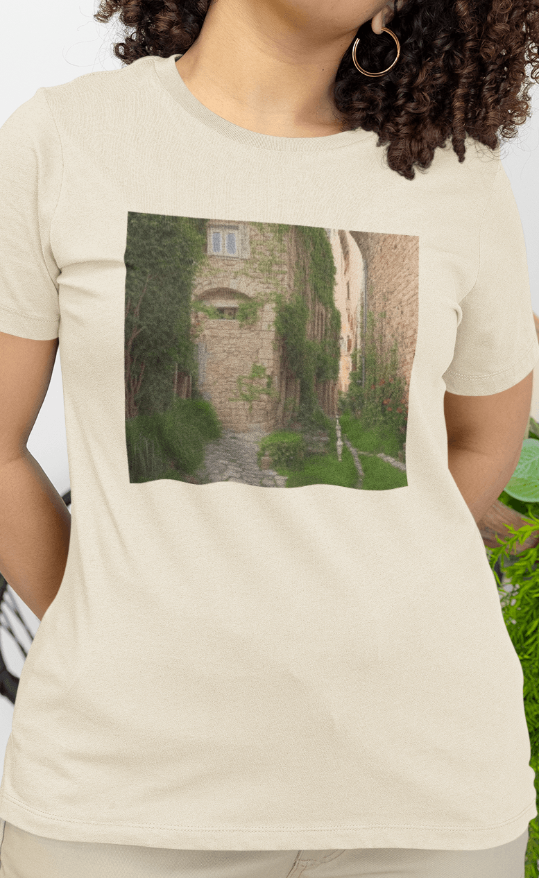 A woman wears an off-white T-shirt featuring a landscape generated by artificial intelligence that looks like Jimmy or Saul from Better Call Saul and Breaking Bad