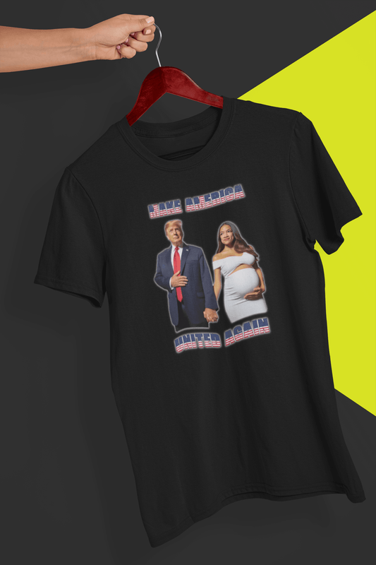 A black T-shirt with an AI depiction of Donald Trump and pregnant AOC holding hands, saying &quot;Make America United Again&quot;, held by a hand against a split black and yellow background.