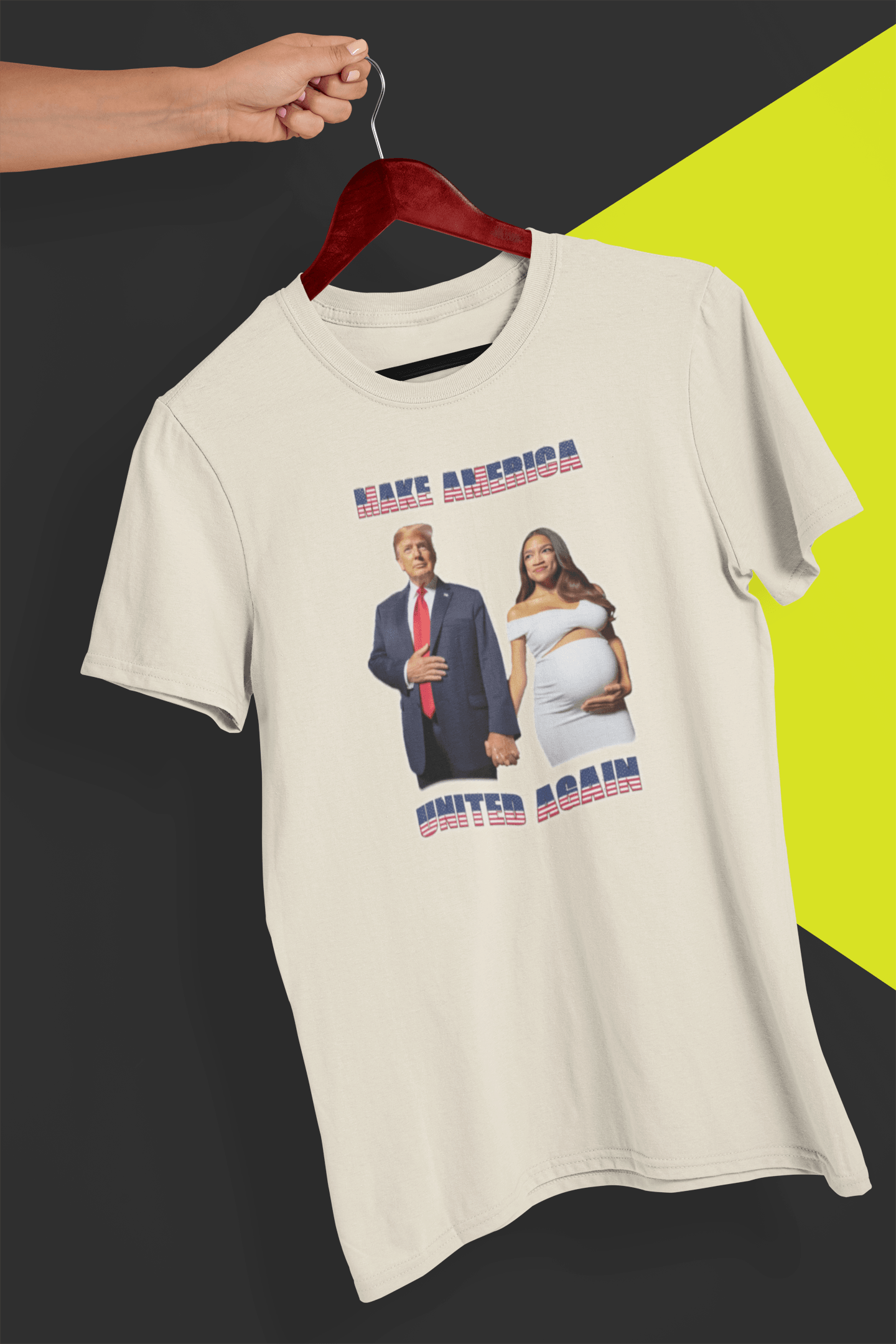 A off-white T-shirt with an AI depiction of Donald Trump and pregnant AOC holding hands, saying &quot;Make America United Again&quot;, held by a hand against a split black and yellow background.