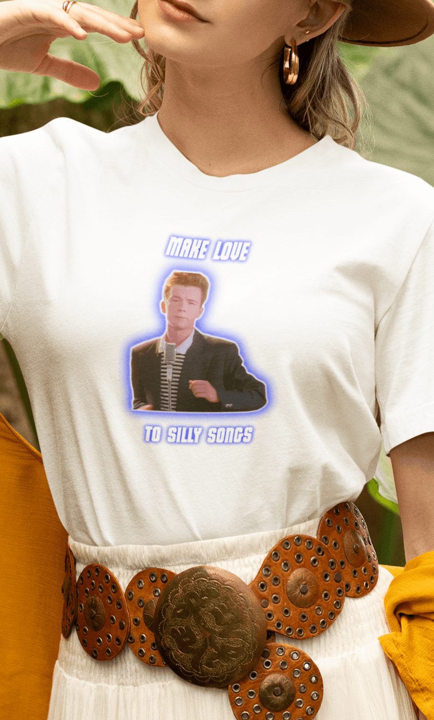 A woman wears a white T-shirt with a depiction of Rick Astley that says &quot;Make Love To Silly Songs&quot;.