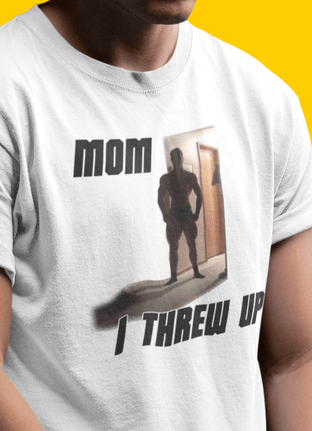 A man wears a white T-shirt featuring a strong man written &quot;Mom I threw up&quot;