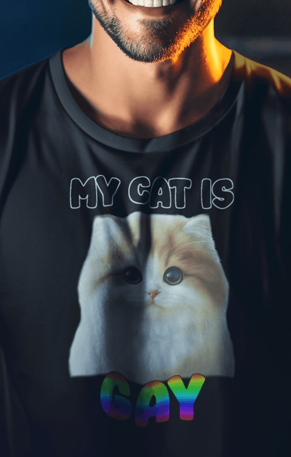 A man wears a black T-shirt featuring a cute cat written &quot;My Cat is Gay&quot; on top.