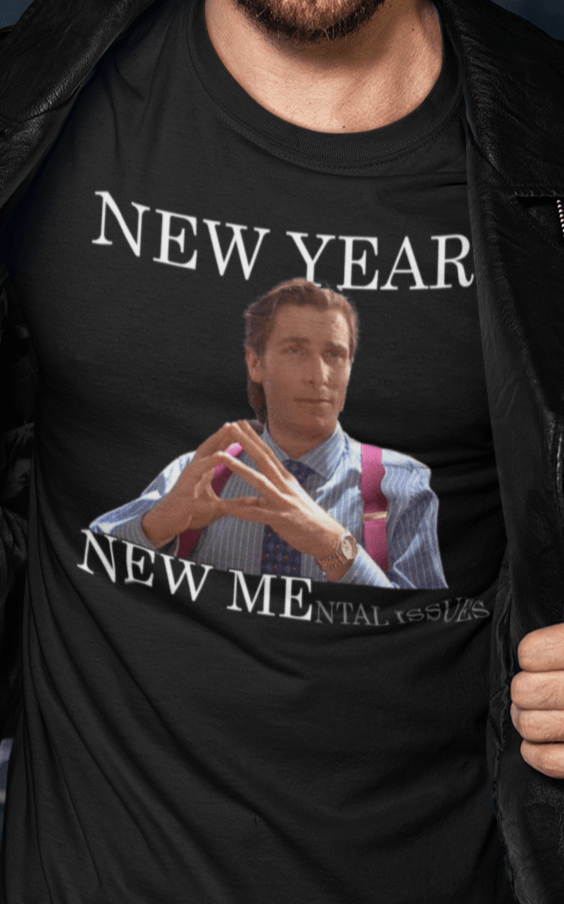 A man wears a black T-shirt featuring Christian Bale in american psycho, saying &quot;New Year, New Mental Issues&quot;.