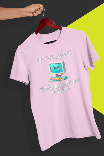 A pink T-shirt with a cute computer written &quot;Not now, sweetie, mom is cyberbullying the mayor&quot;, held by a hand against a split black and yellow background.