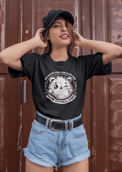 A woman  wears a black T-shirt featuring a cute hamster doing a thumbs up written &quot;OK GUYS YOU CAN STOP THE MAJOR HISTORICAL EVENTS&quot;.