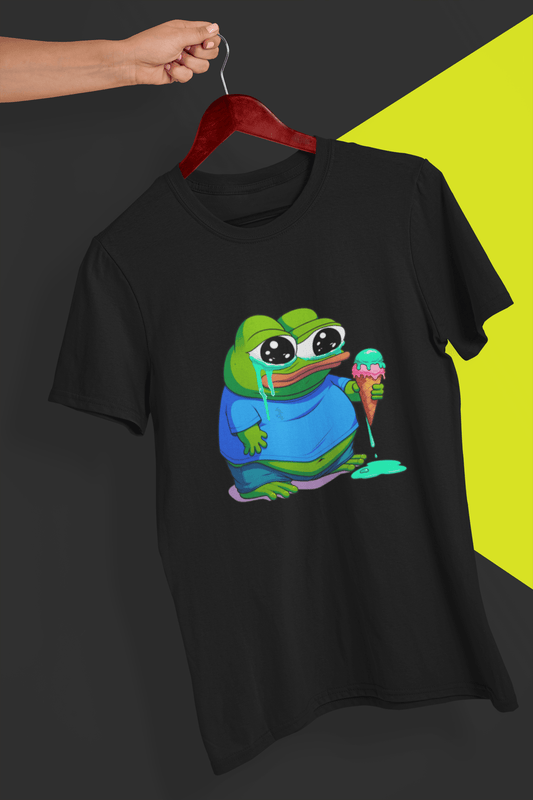 A black T-shirt with a cute apu apustaja pepe in the middle, held by a hand against a split black and yellow background.