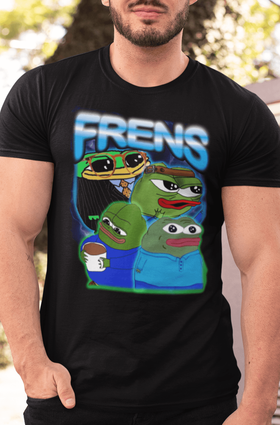 A strong man wears a black T-shirt featuring four cute pepes and peepos written &quot;FRENS&quot; on top.