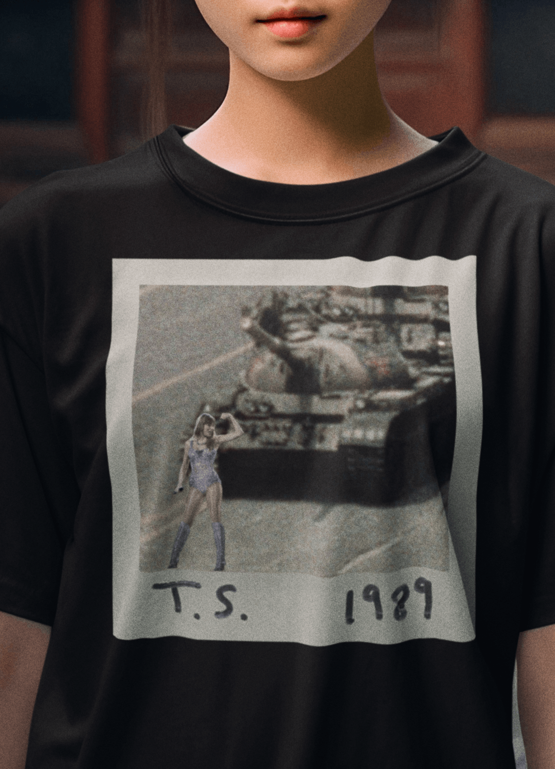 A girl wearing a black T-shirt with Taylor Swift in front of a tank written &quot;T.S. 1989&quot;.