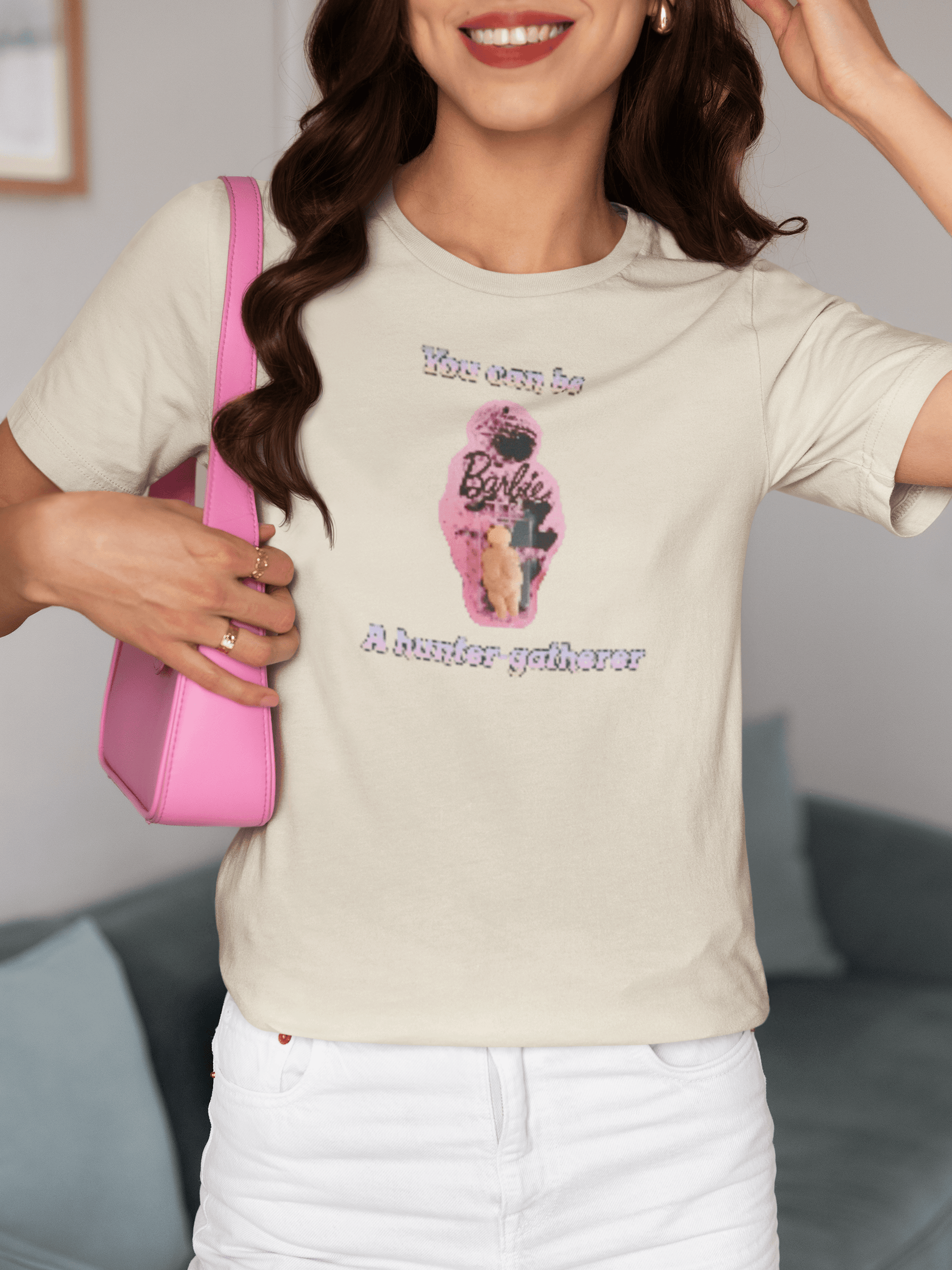 A woman wears an off-white T-shirt featuring the venus impudique that says &quot;Barbie You can be a hunter-gatherer&quot;.