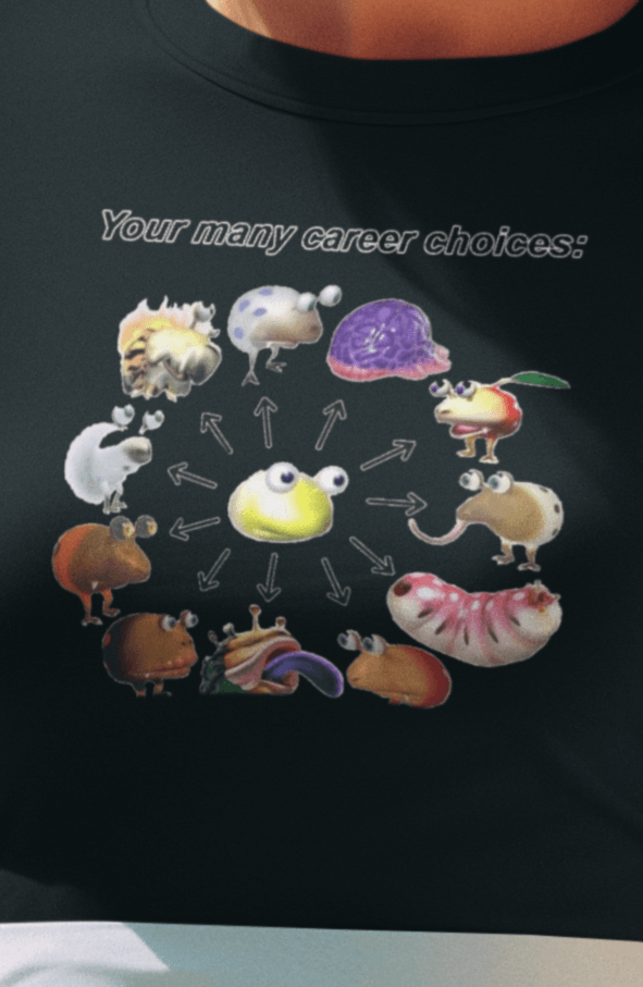 A woman wears a black T-shirt saying &quot;Your many career choices:&quot;, featuring a bunch of cute weird monsters