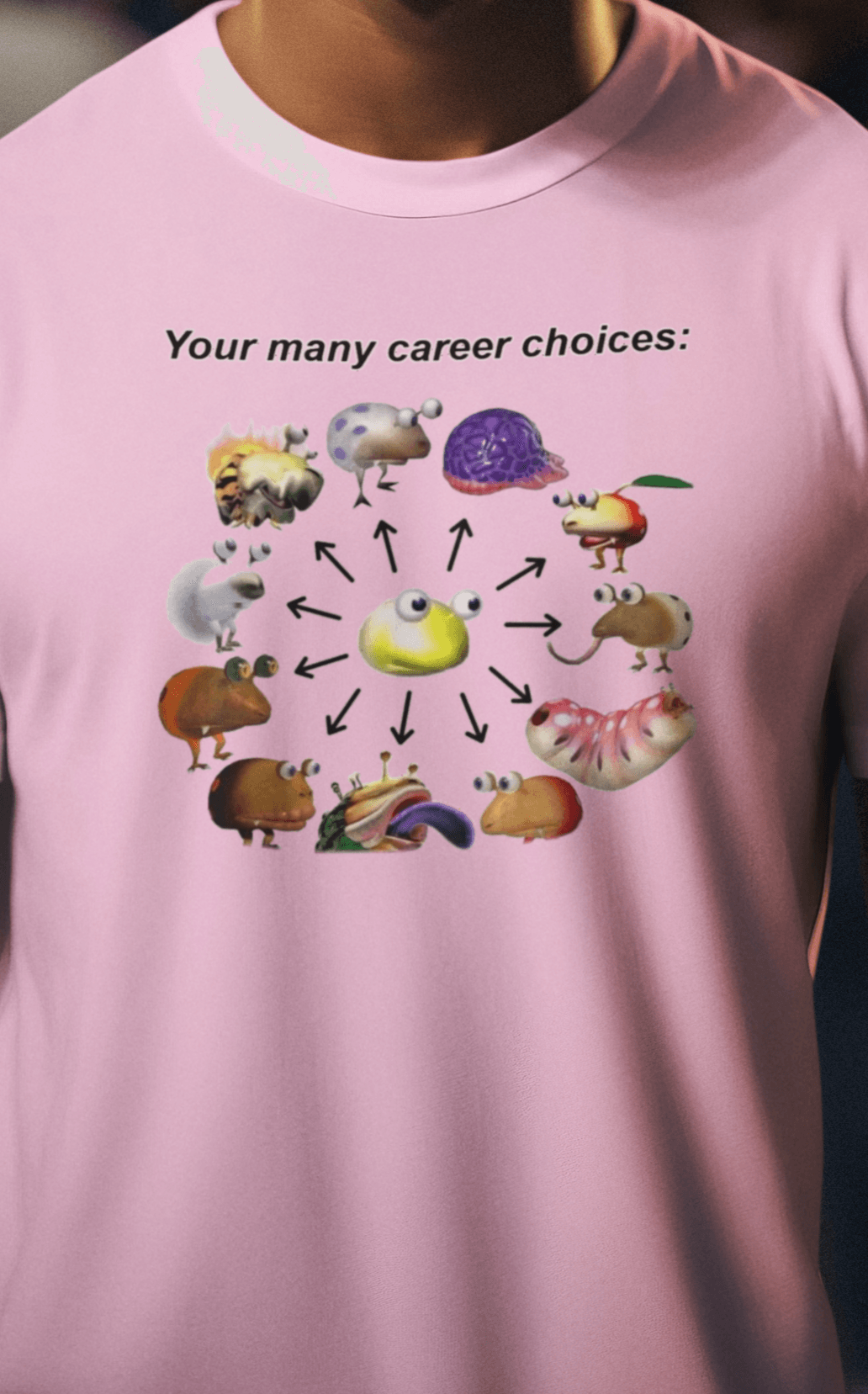 A man wears a pink T-shirt saying &quot;Your many career choices:&quot;, featuring a bunch of cute weird monsters